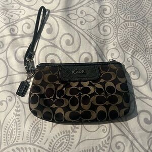 Very used monogram Coach wristlet